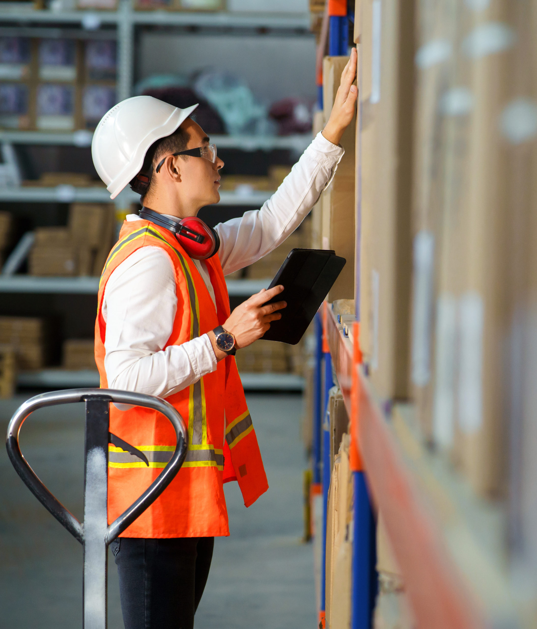 Employee of a logistics warehouse conducts an inventory of products